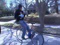 Guy riding bike backwards - ukalele