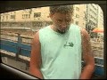 Brazilian Carnival - man pissing on television car