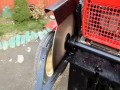 Ciągnik SAM z piłą do cięcia opału Osielec